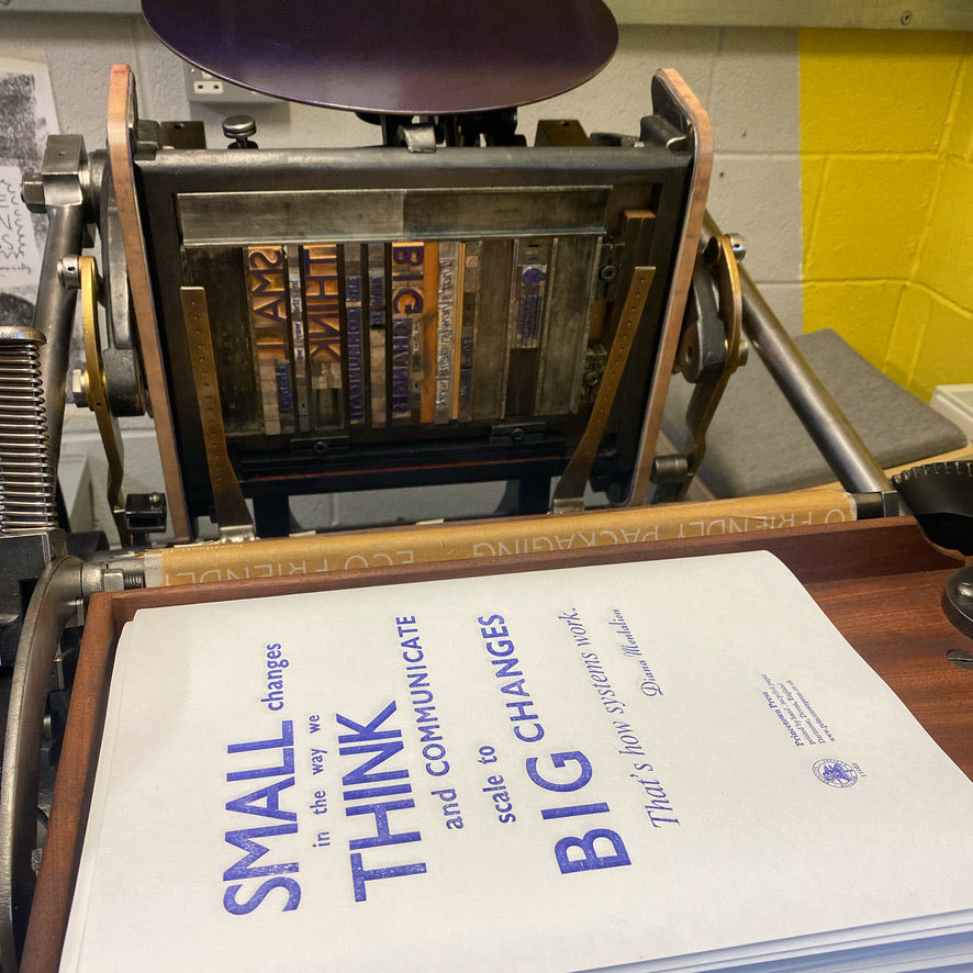 printed posters sitting next to their form